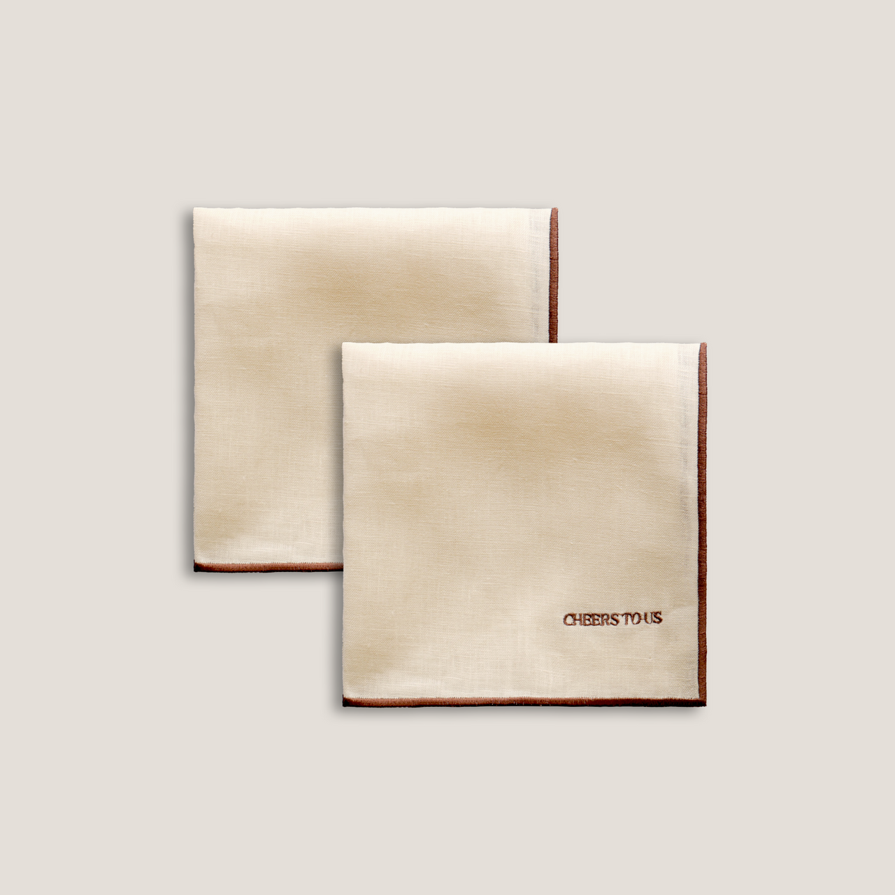 Napkins 'cheers to us' in beige 